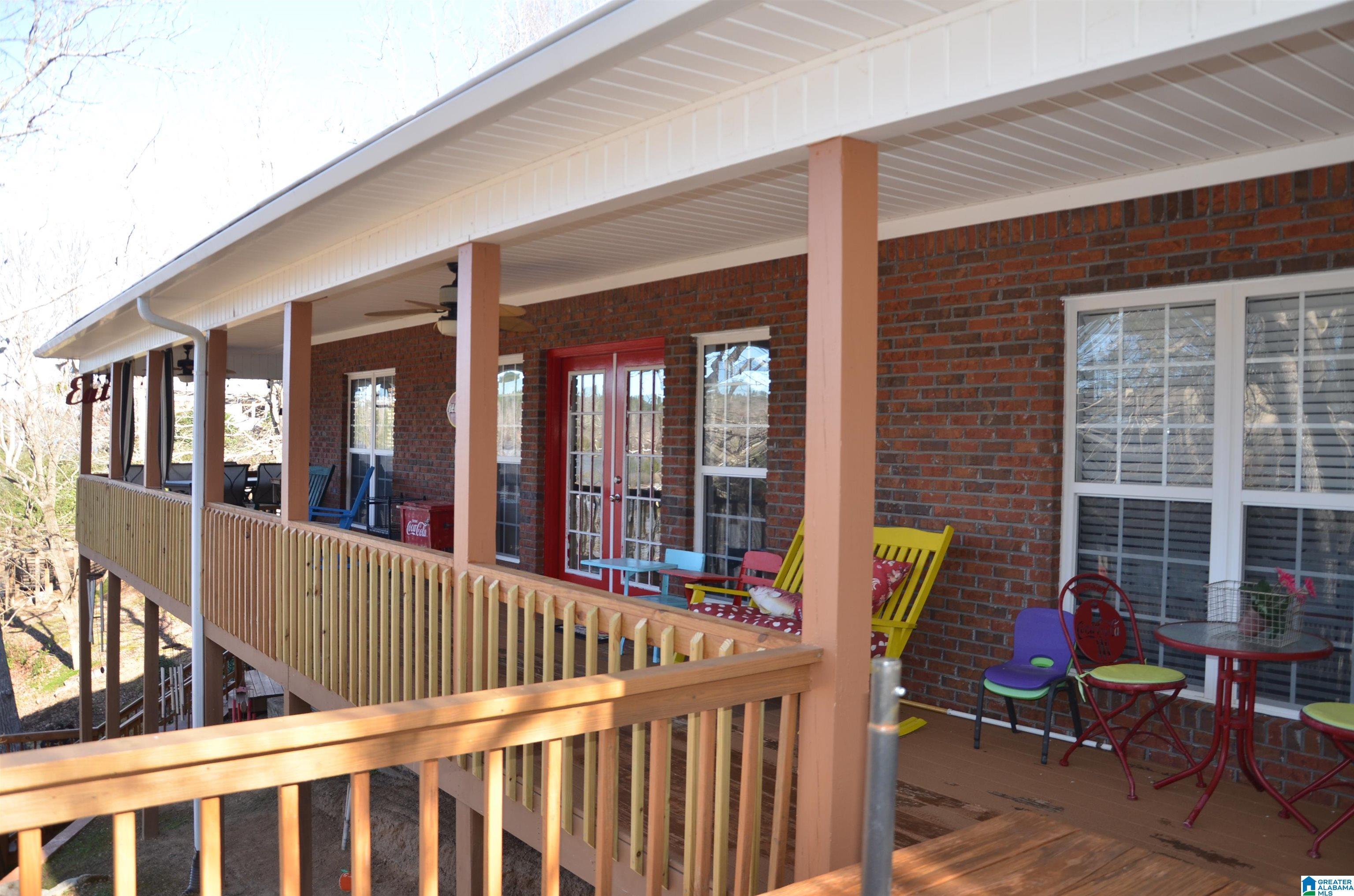 Image 2: Large wrap around covered deck overlooking lake