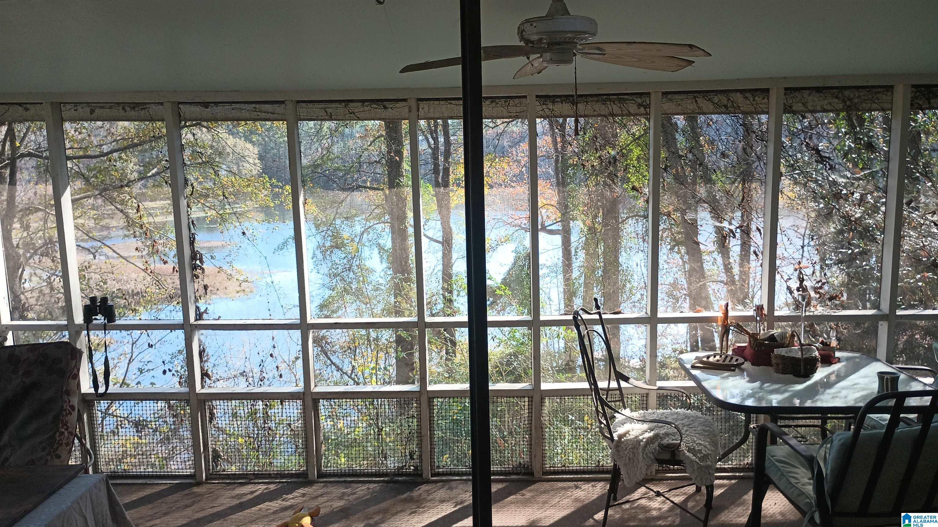 Image 3: LAKE VIEW: FROM LIVING ROOM THROUGH BACK PORCH