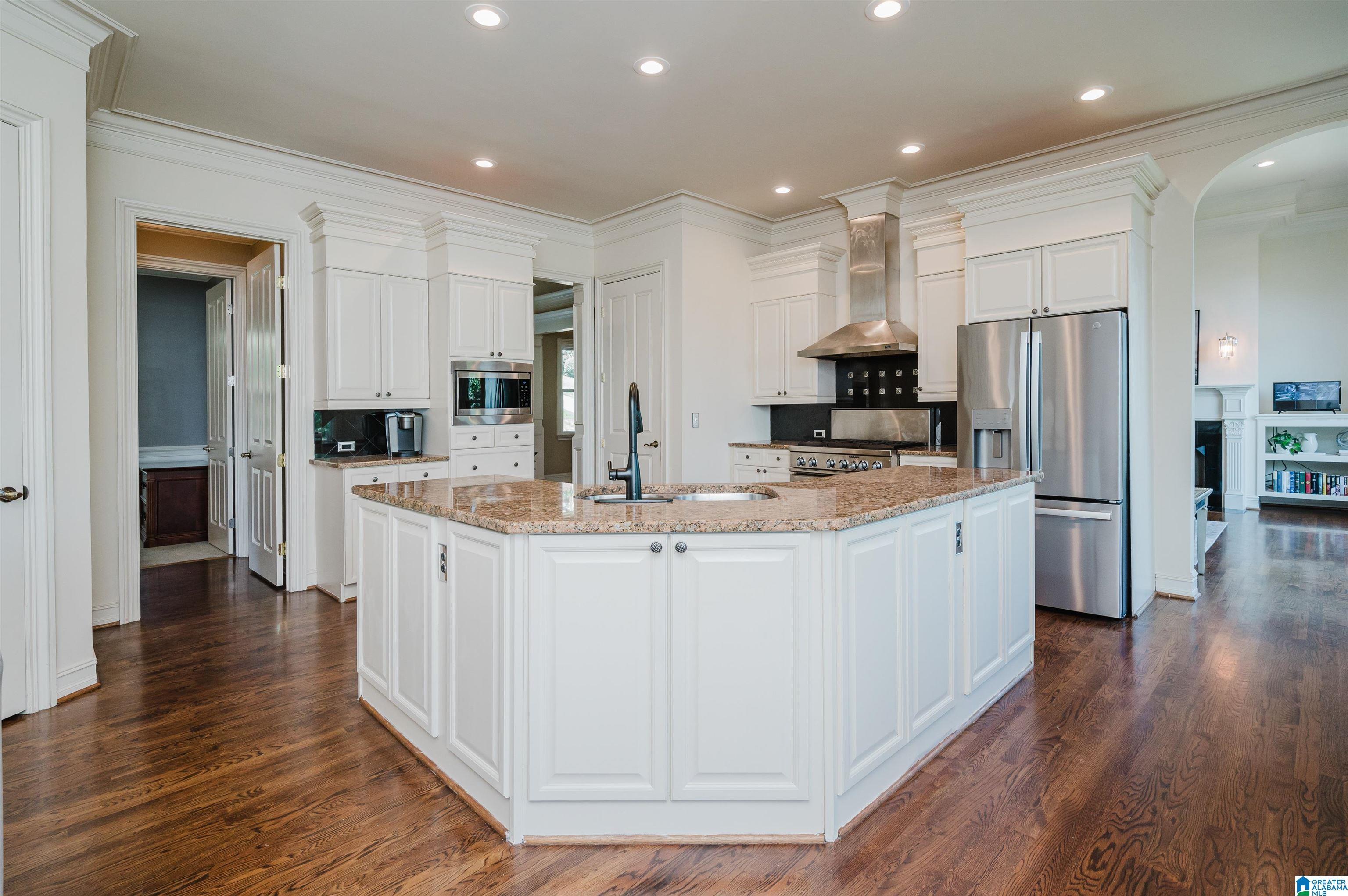Image 4: kitchen open to eating area and keeping room