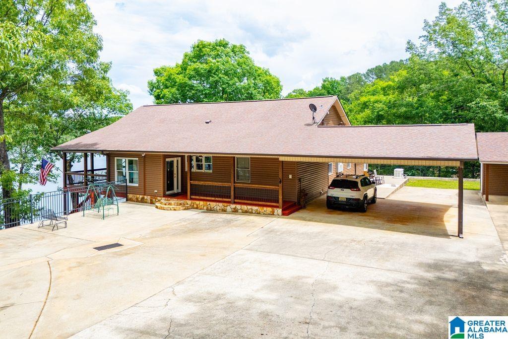 Image 2: PAVED DRIVEWAY AND COVERED PARKING