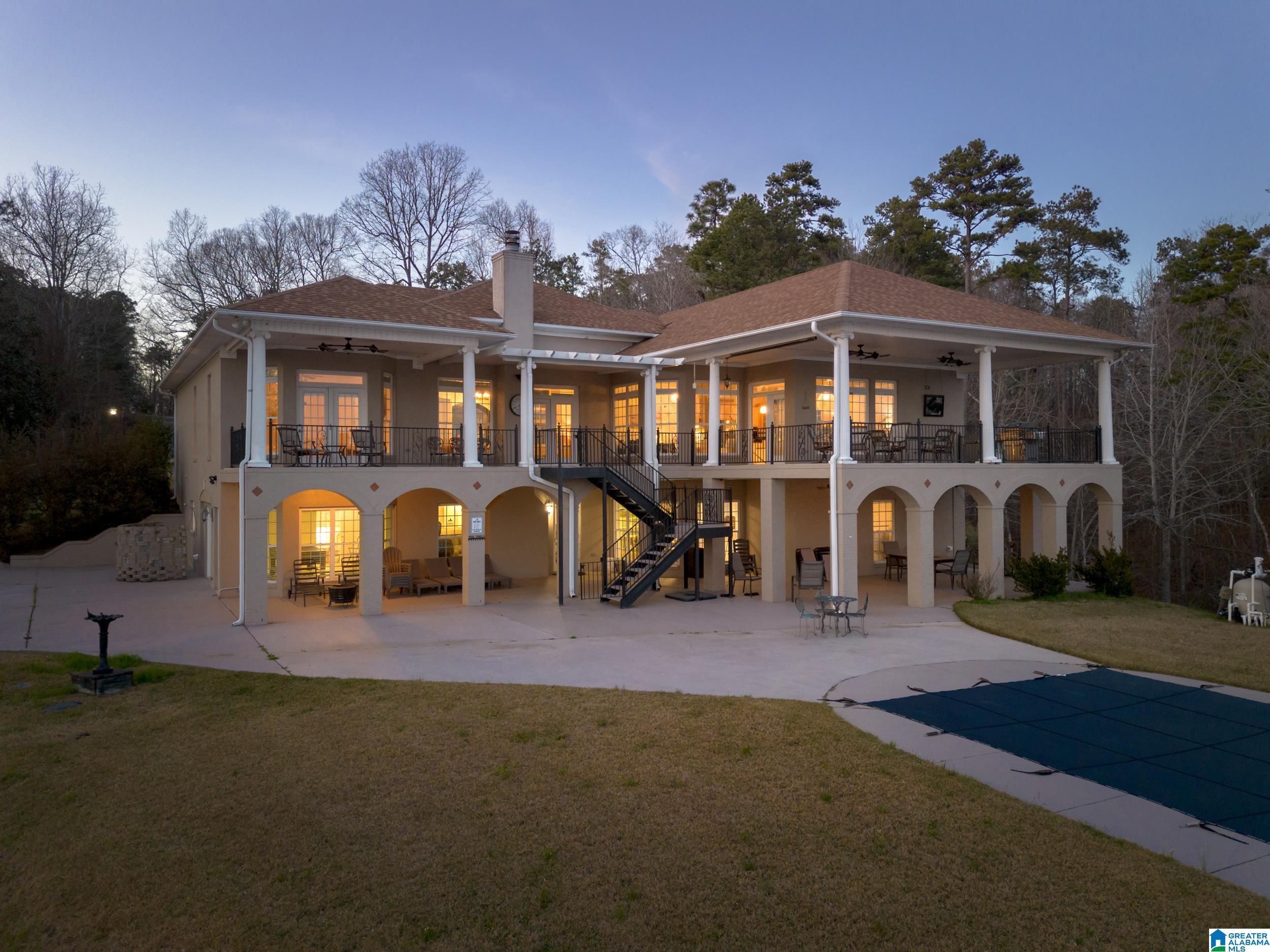 Image 1: Back of home facing lake