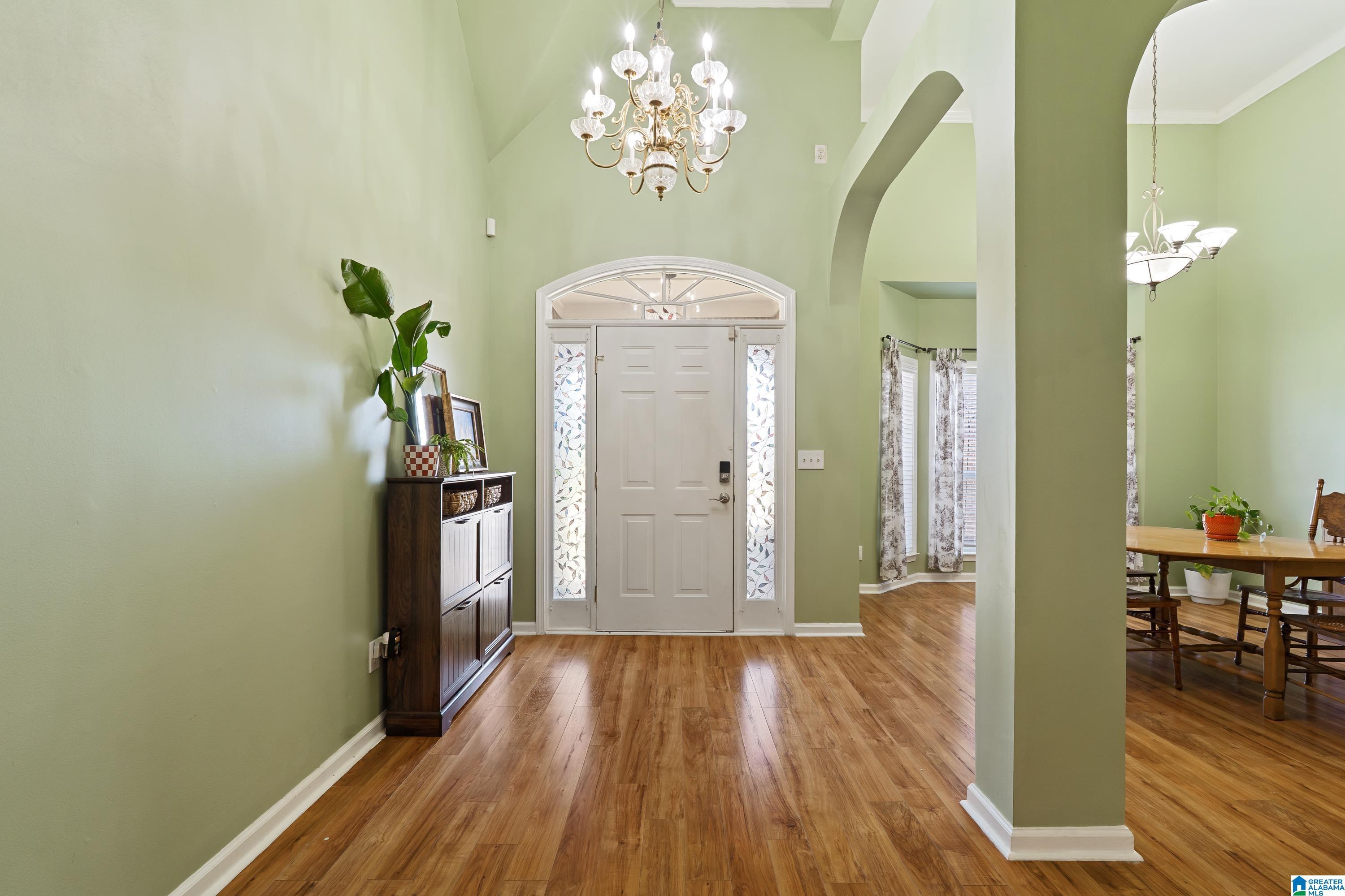 Image 3: Foyer | High Ceilings | Chandalier | Hardwood Lami