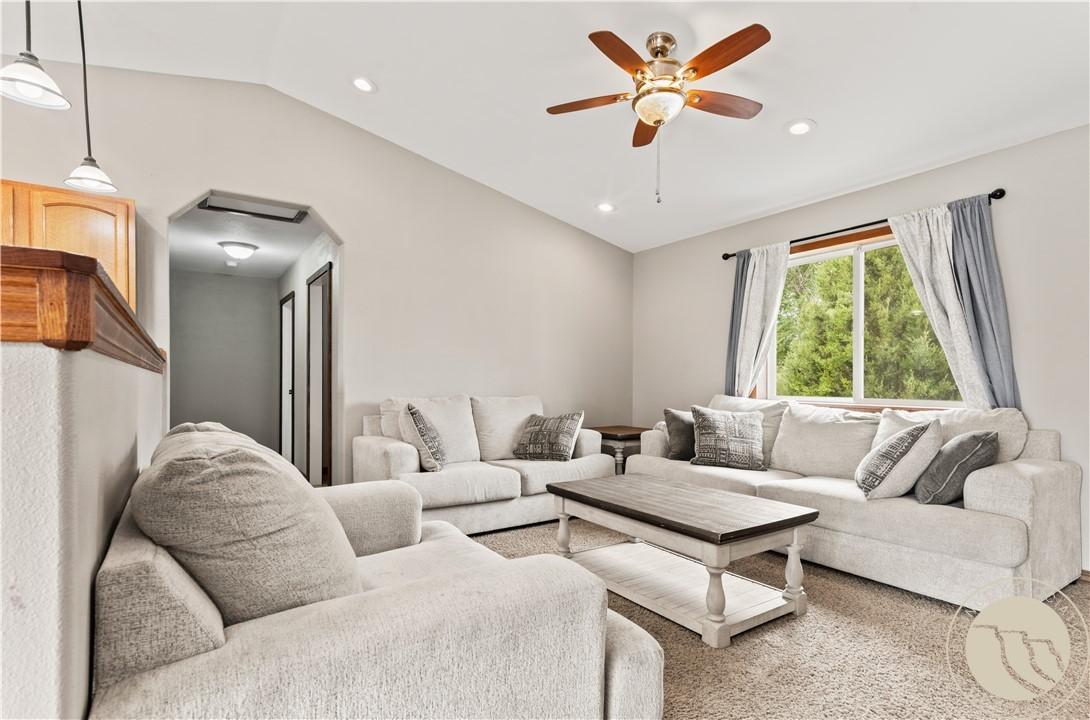 Image 3: Angle of living room as seen from across entrance.