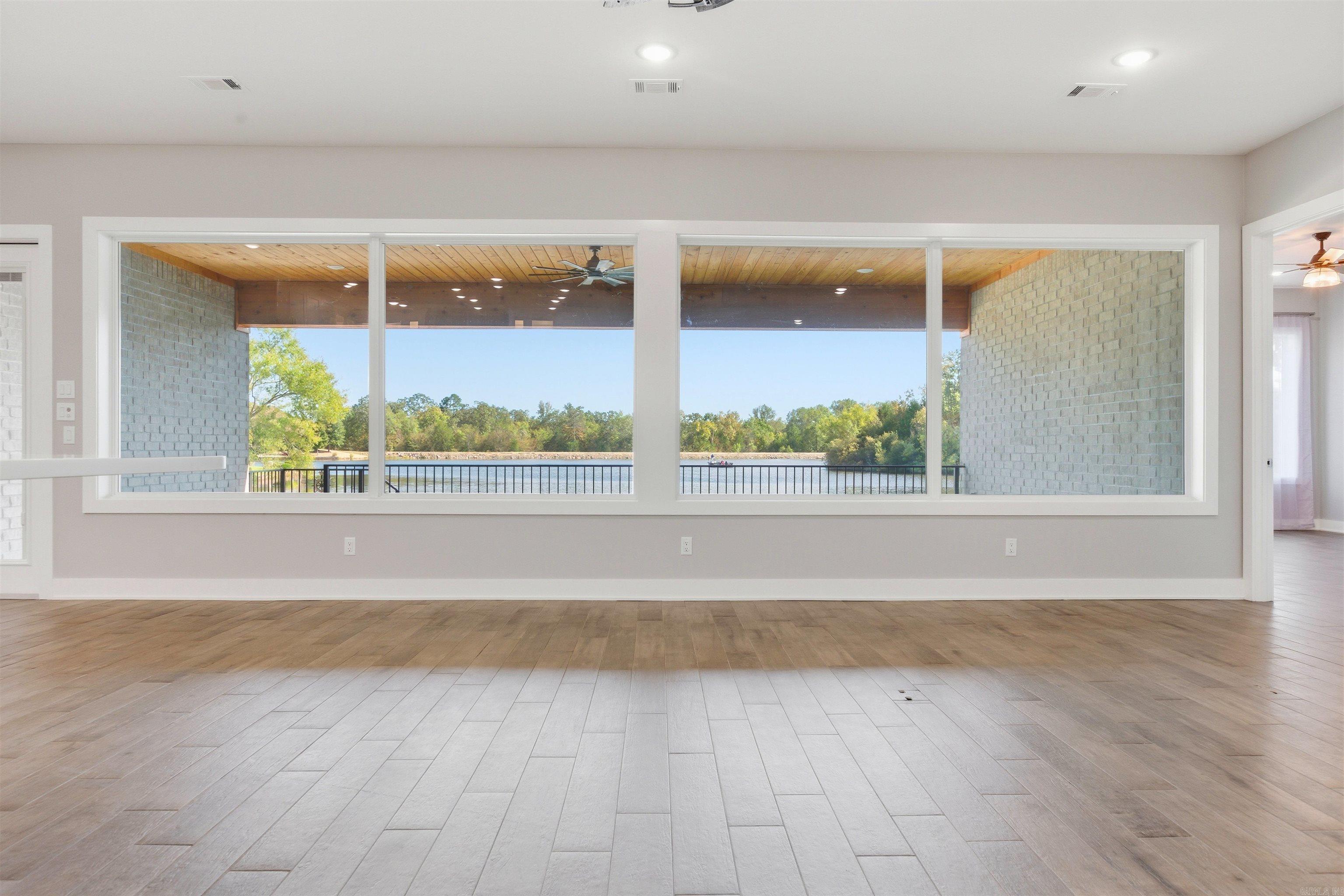Image 3: open-concept living with lake views, Living Room