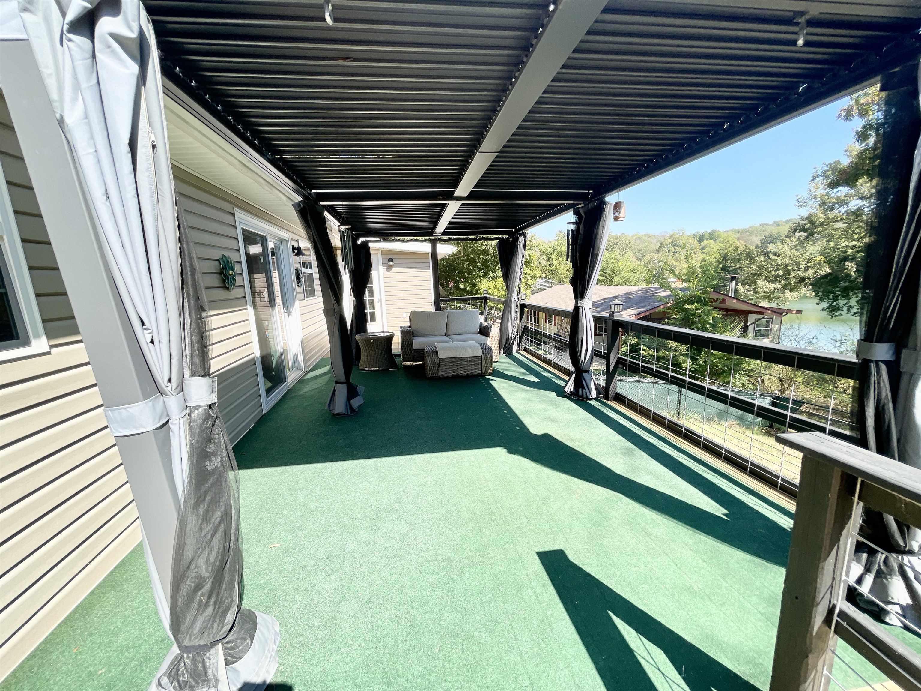 Image 3: LARGE DECK OVERLOOKING THE LAKE