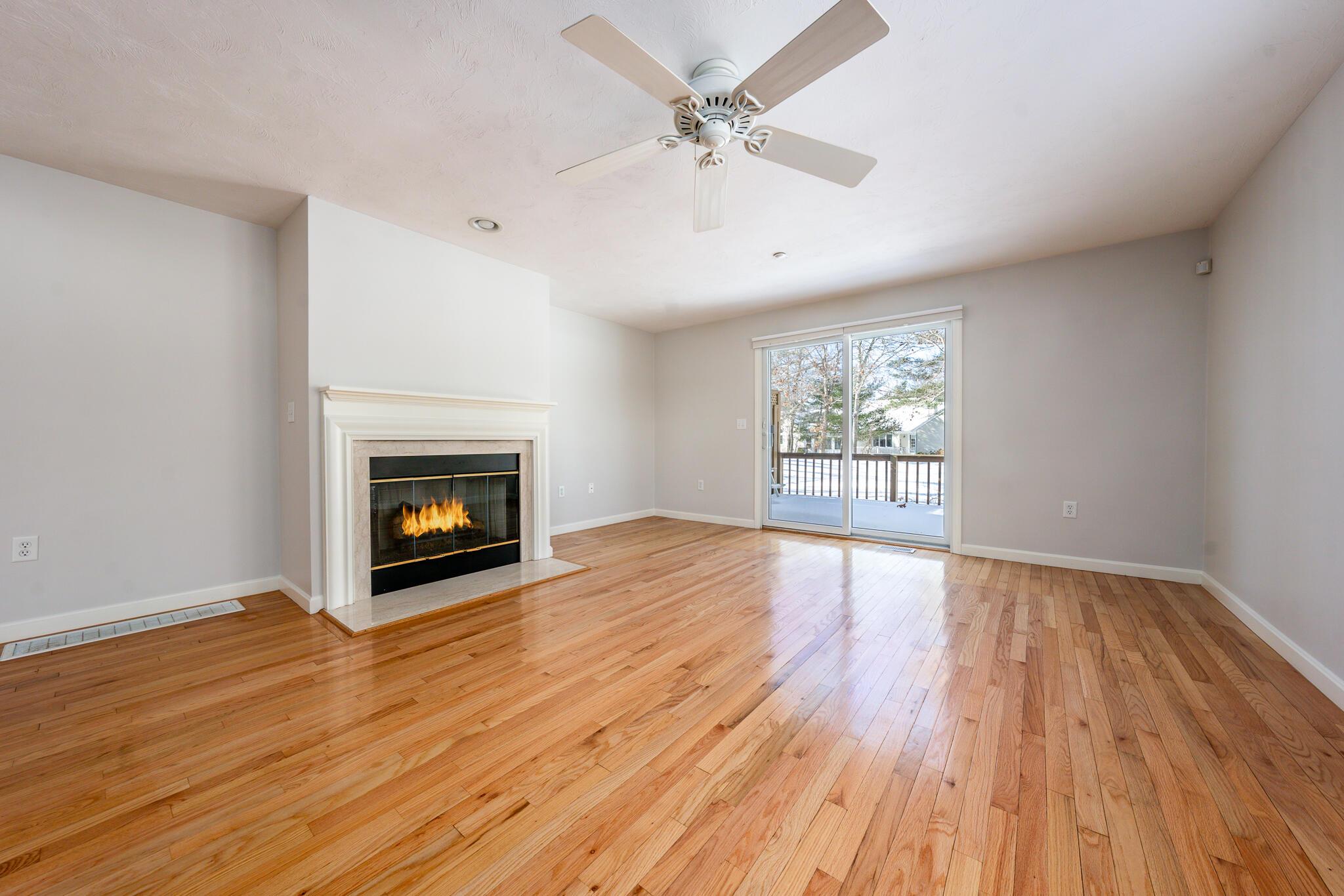 Image 4: Living room w/ gas fireplace