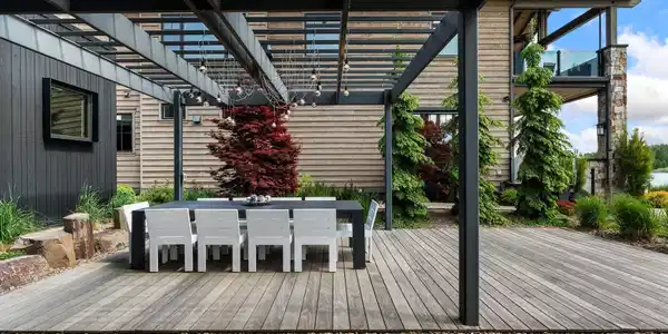 Image 4: Dining under the lit pergola