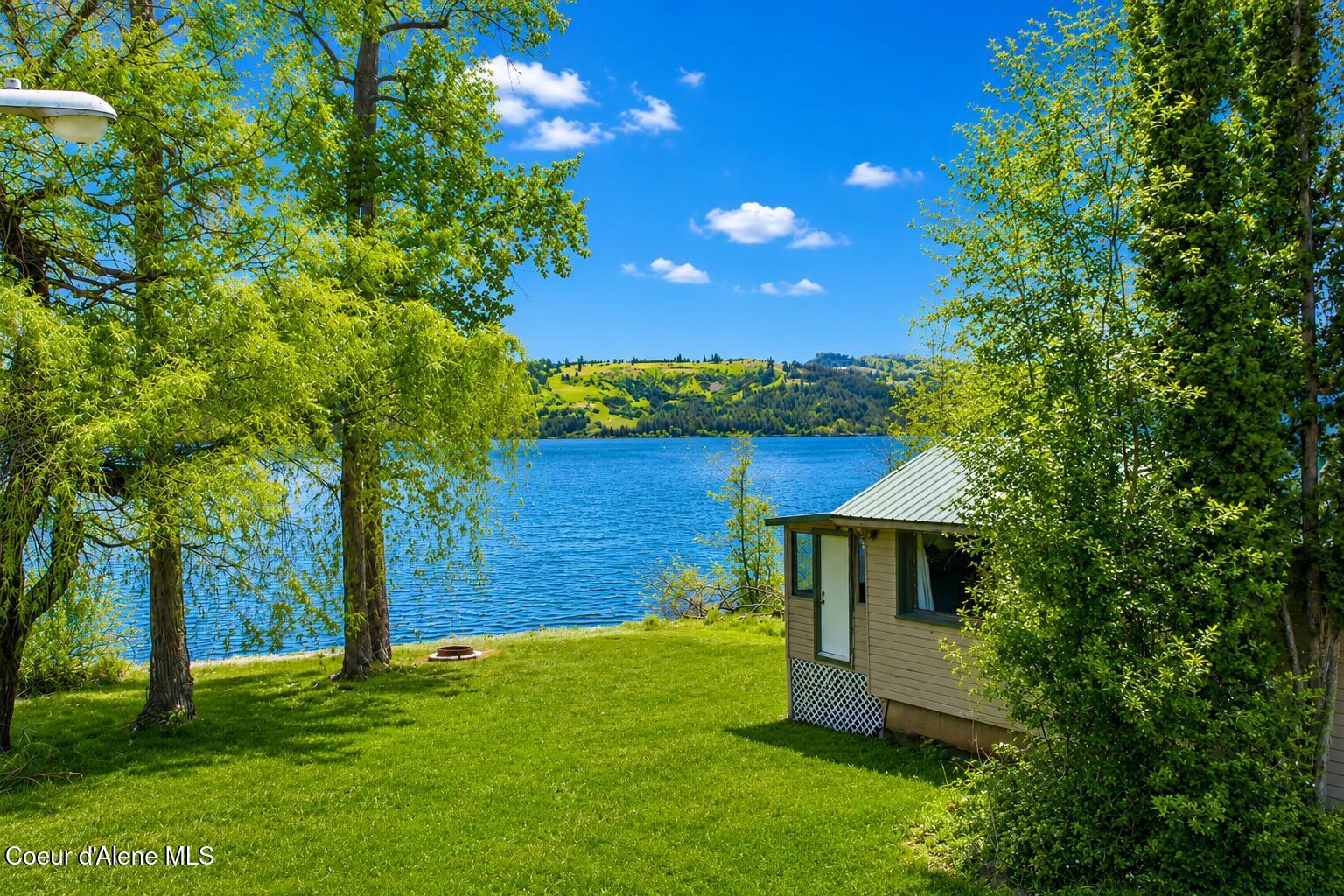 Image 1: Cabin and Water
