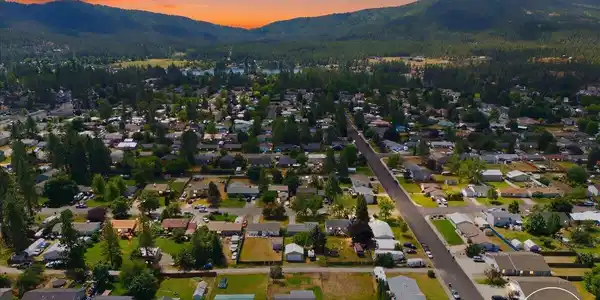 Image 2: 01-Twilight Aerial Front of Home waterma