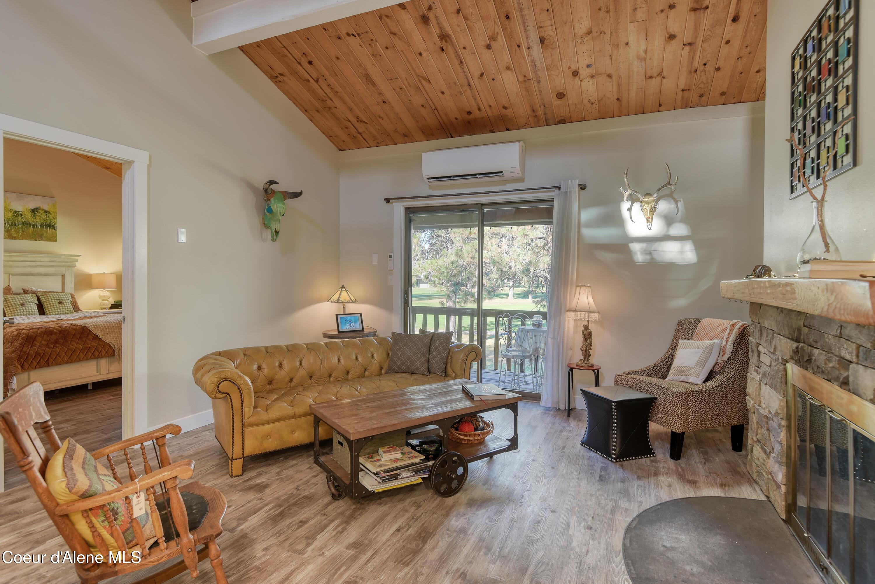 Image 4: Living Room with Covered Balcony