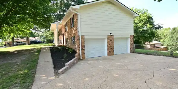Image 4: New garage doors & cement board siding.