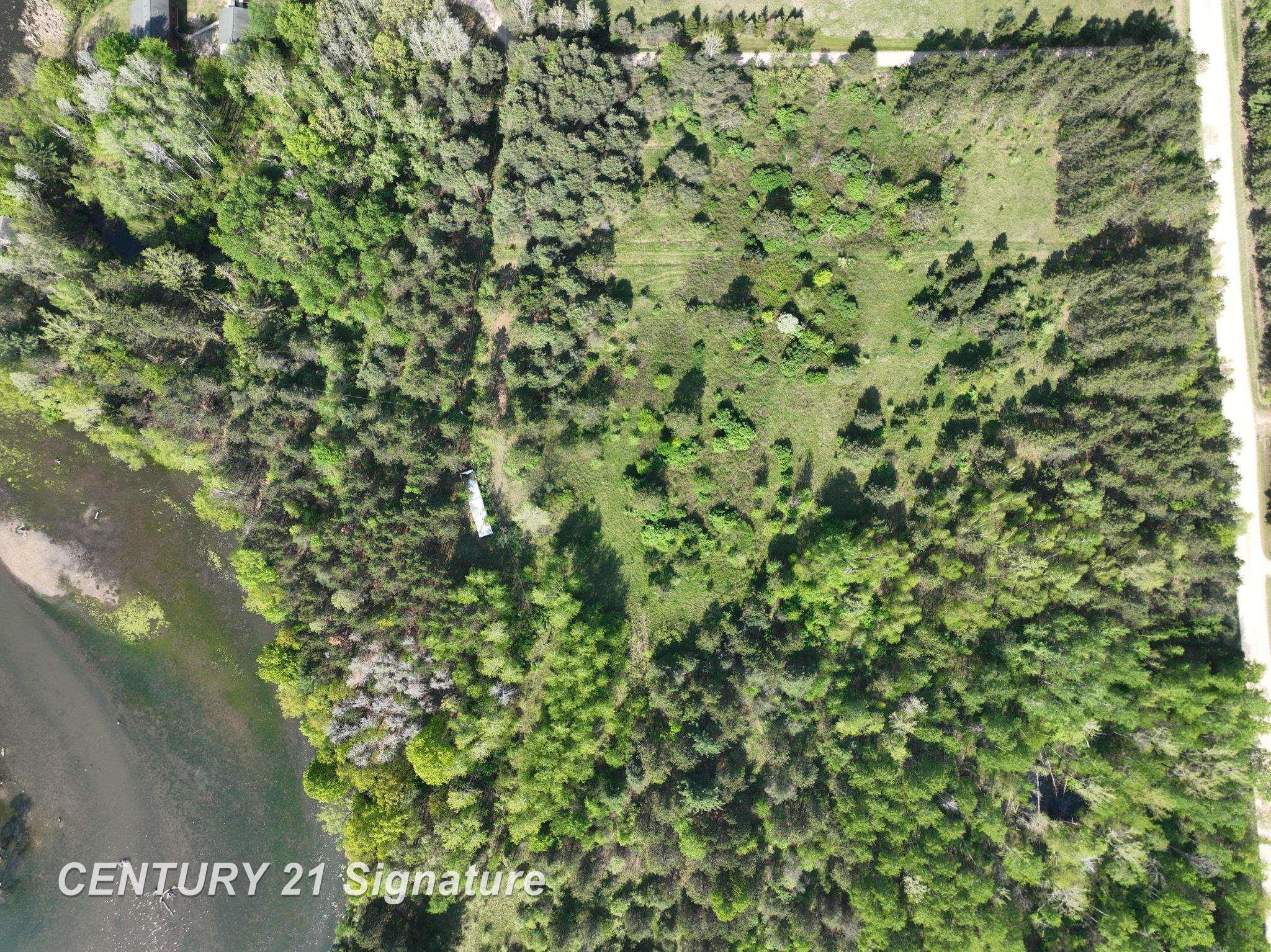 Image 1: The structure shown in this photo is on the parcel that was already purchased. Boundary close to the structure, do not walk neighbors land when touring please.