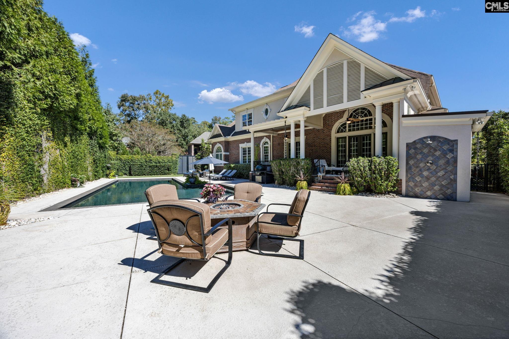 Image 2: fire table with built-in gas line; outdoor shower (w hot and cold!), Exterior Back - Firepit Table