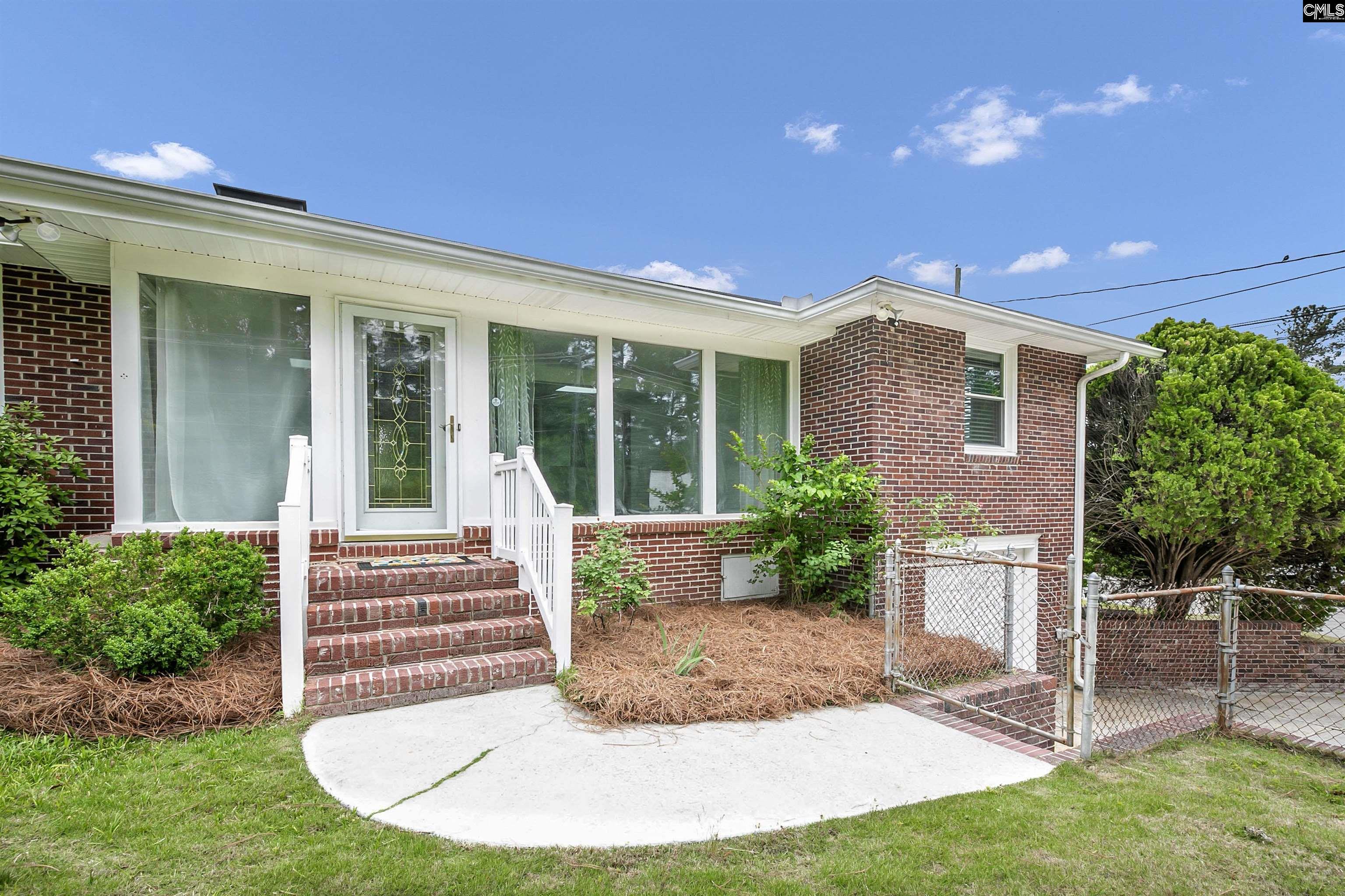 Image 1: 4603 Trenholm Road - Charming Brick Ranch in the Heart of Forest Acres, Back Entrance and Garden