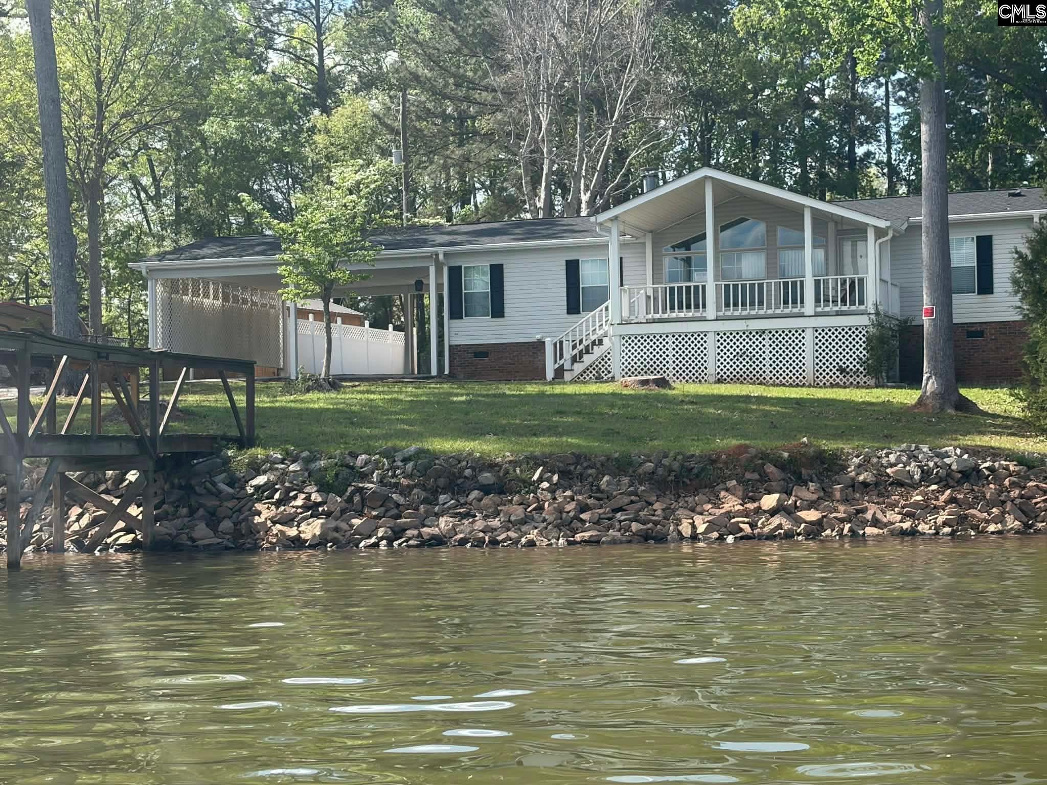 Image 0: VIEW OF HOME FROM WATER