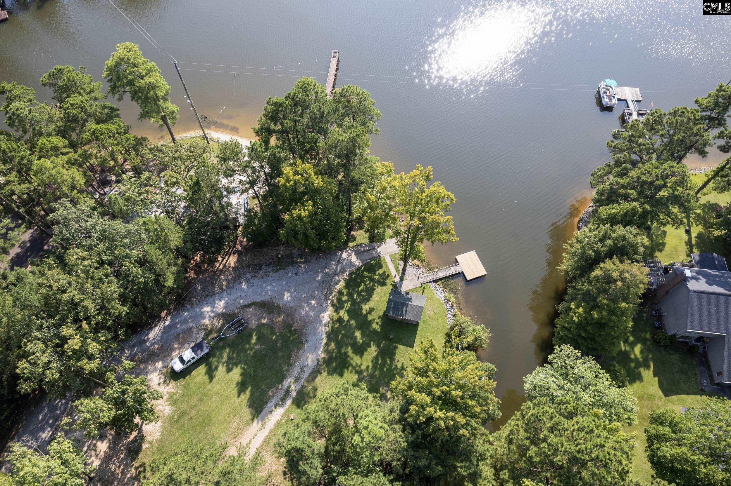 Image 1: Community has a large lot with dock, boat ramp and covered picnic area.  All this for $100 per year, Start Enjoying This Lake Front Community Now