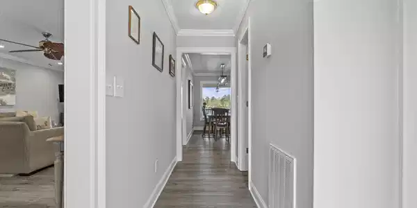Image 1: Welcoming entryway with LVP flooring and access to main living areas, Entryway