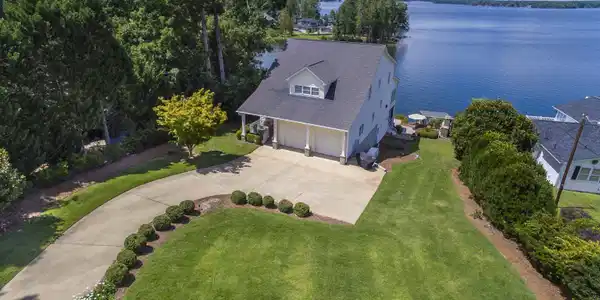 Image 2: Beautiful lawn and landscaping with irrigation well
