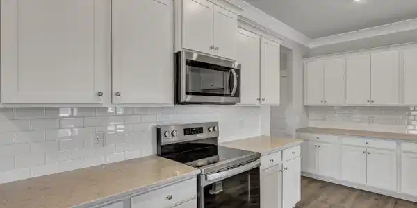 Image 2: *Quartz countertops will be white, Tile backsplash and white cabinetry