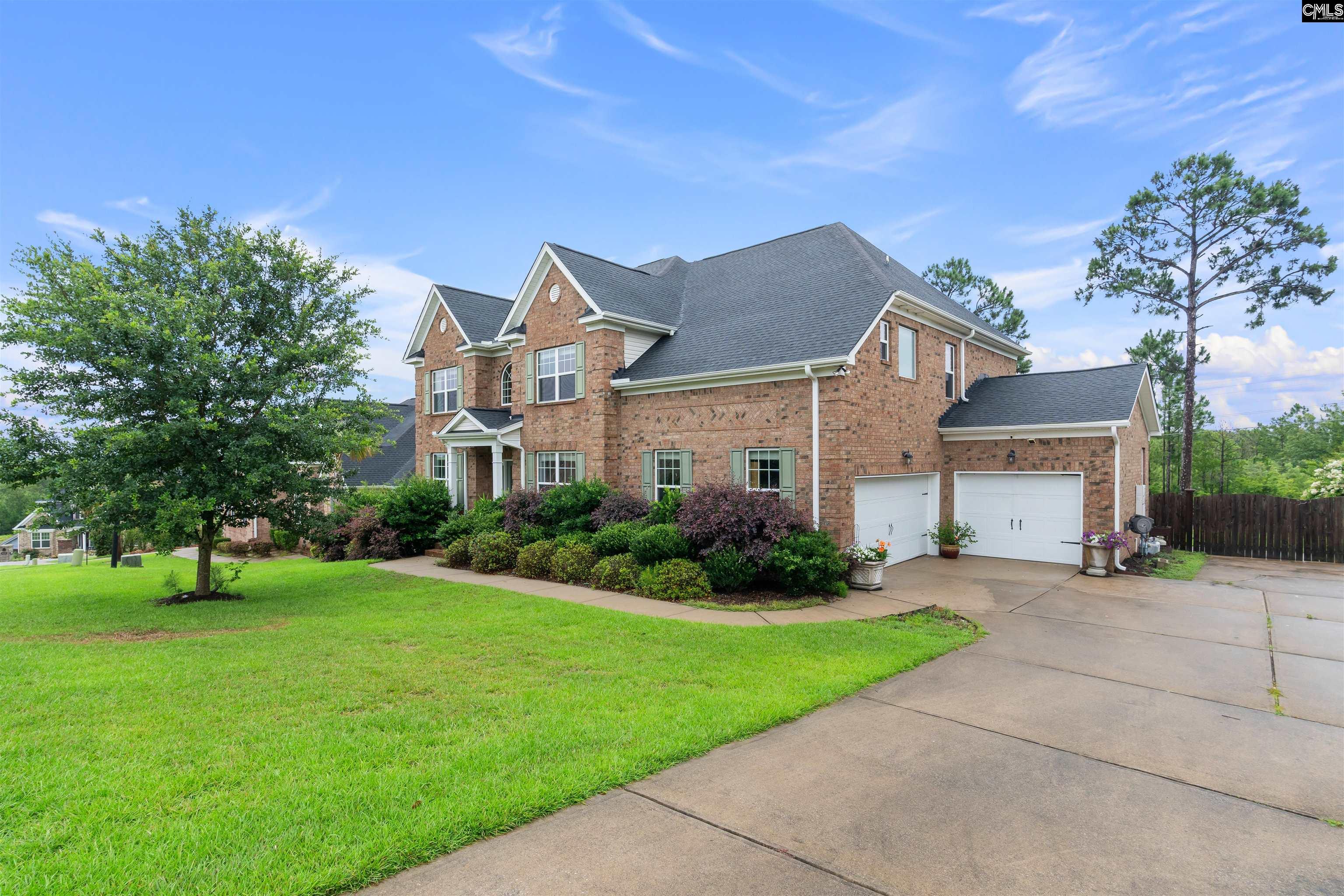 Image 1: Simply stunning brick home with a 3-car garage