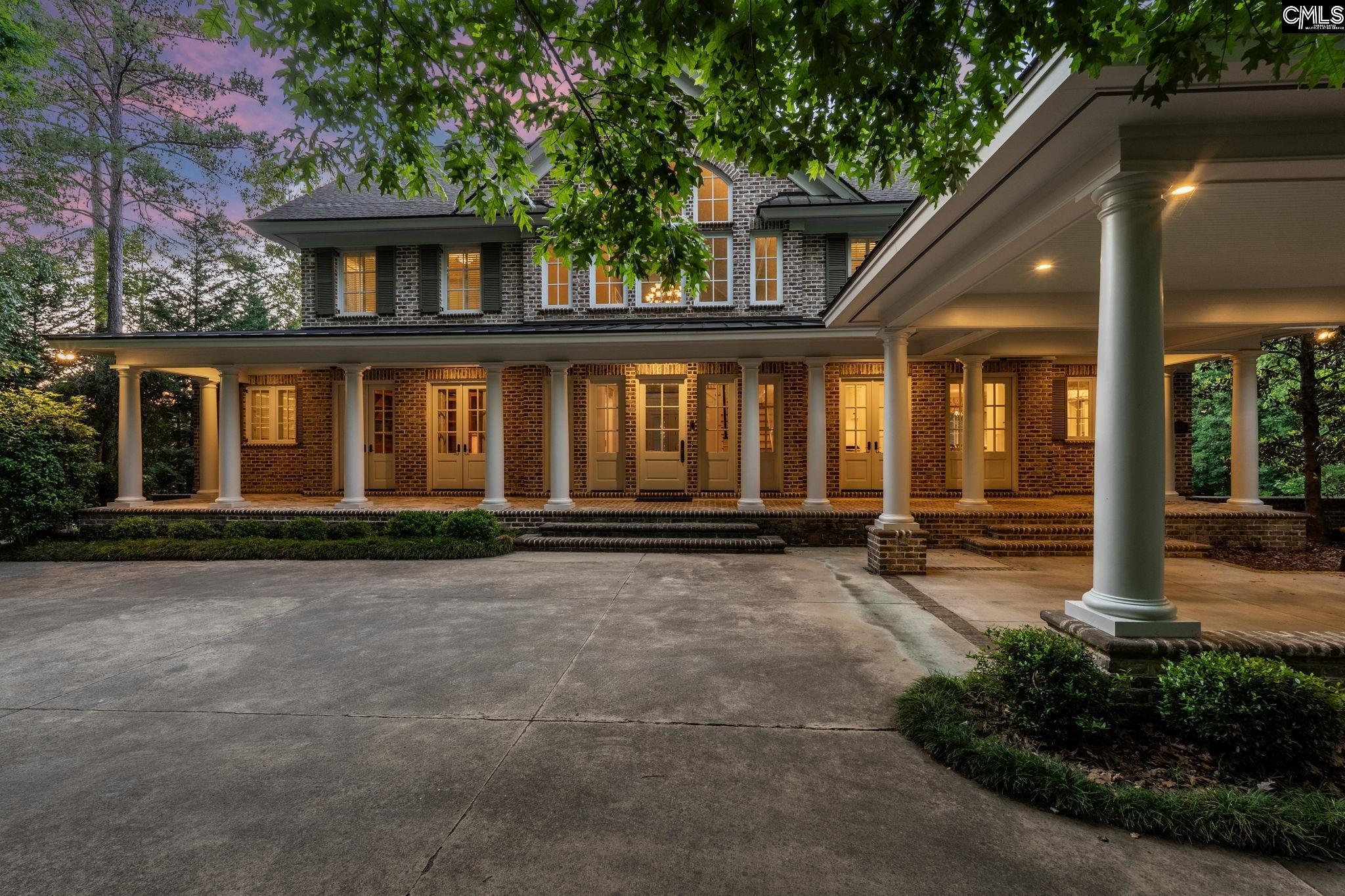 Image 2: Porte-cochere and full porch colonnade lit