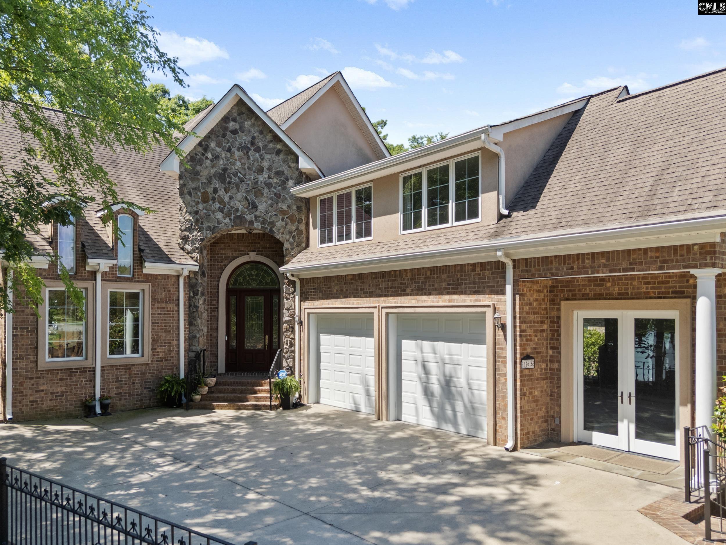 Image 1: 2 car garage with a perfect spot for golf cart or extra lake toys, 2 plus garage spaces