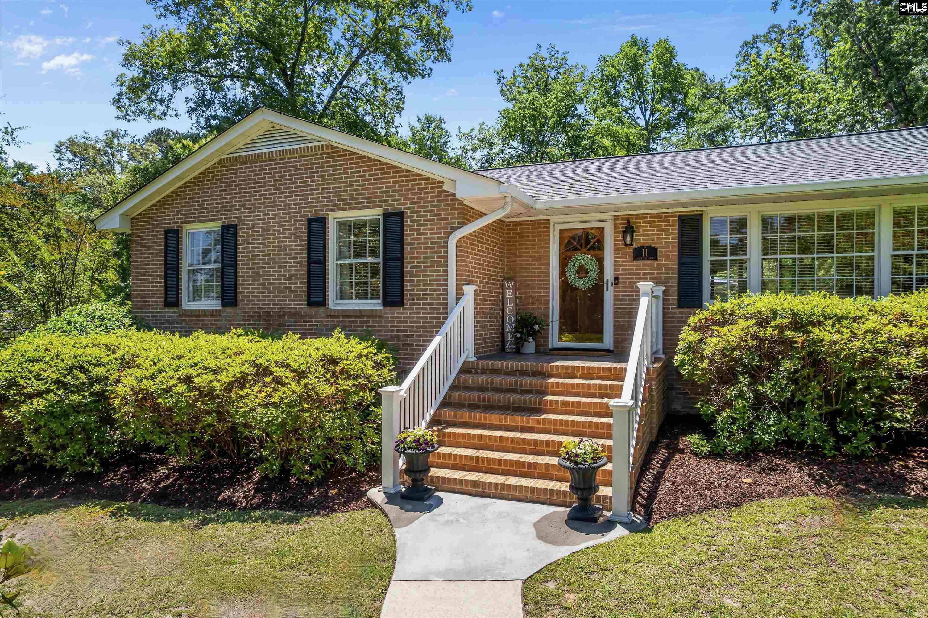 Image 0: Charming updated one-level brick home