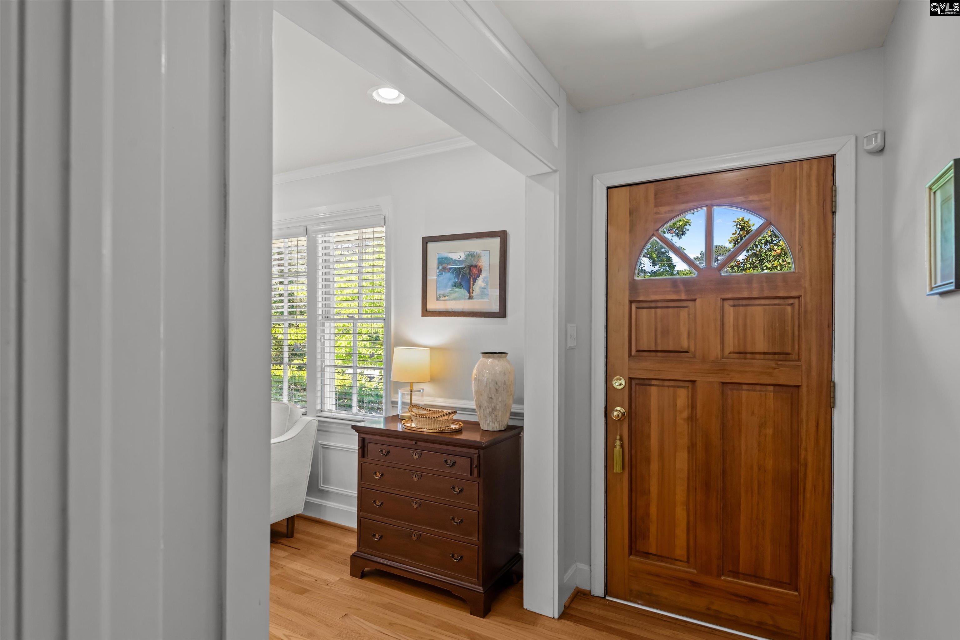 Image 2: Front entrance opens to foyer and living room