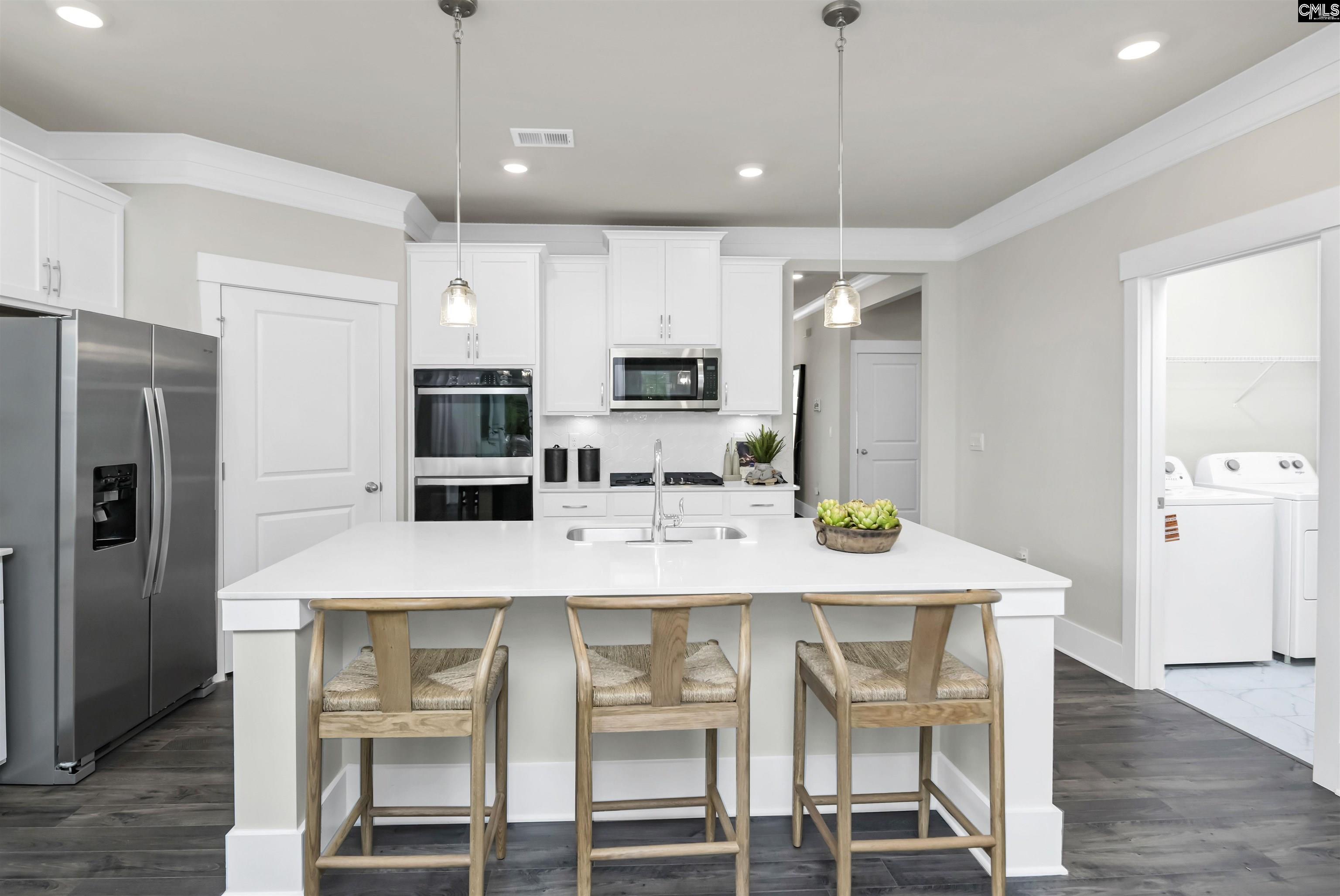 Image 2: Darby kitchen with white cabinetry and quartz countertops