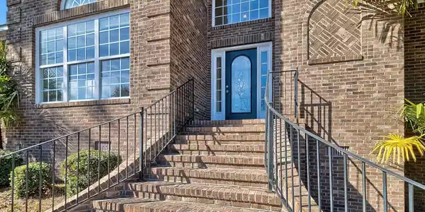 Image 2: Welcoming Entry with Flared Brick Stairs