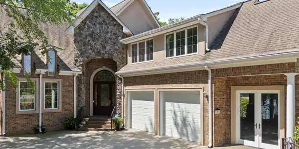 Image 3: 2 car garage with a perfect spot for golf cart or extra lake toys, 2 plus garage spaces