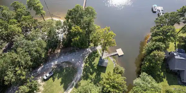 Image 1: Community has a large lot with dock, boat ramp and covered picnic area.  All this for $100 per year, Start Enjoying This Lake Front Community Now