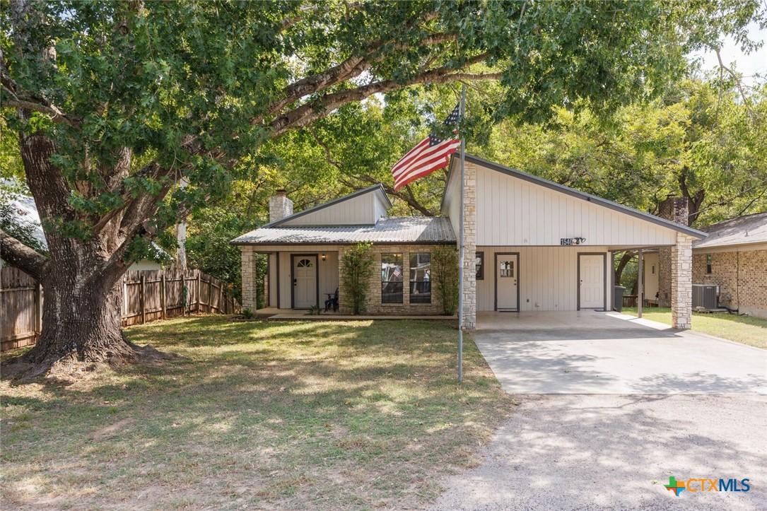 Image 2: Front of home features a mid-century aesthetic wit