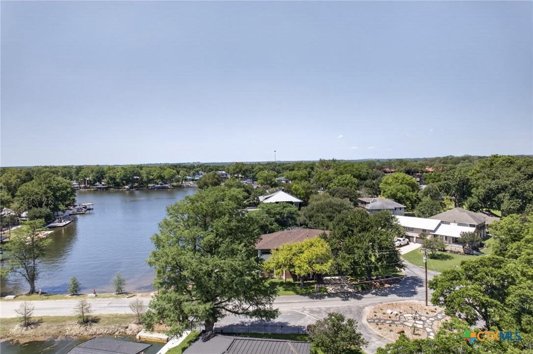 Image 3: Drone shot of house and lake