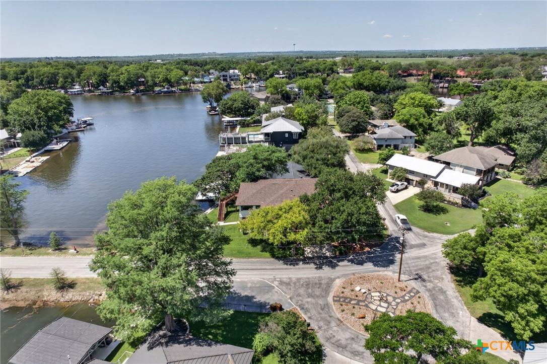 Image 2: Drone shot of house and lake