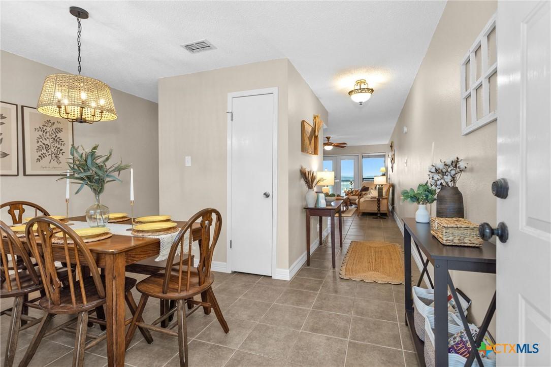 Image 4: Entry way to dining room and hall to living room
