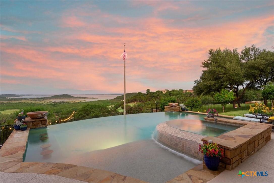 Image 1: Infinity pool and hot tub