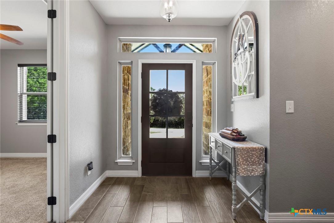 Image 3: Entryway with Secondary Bedroom to our Left