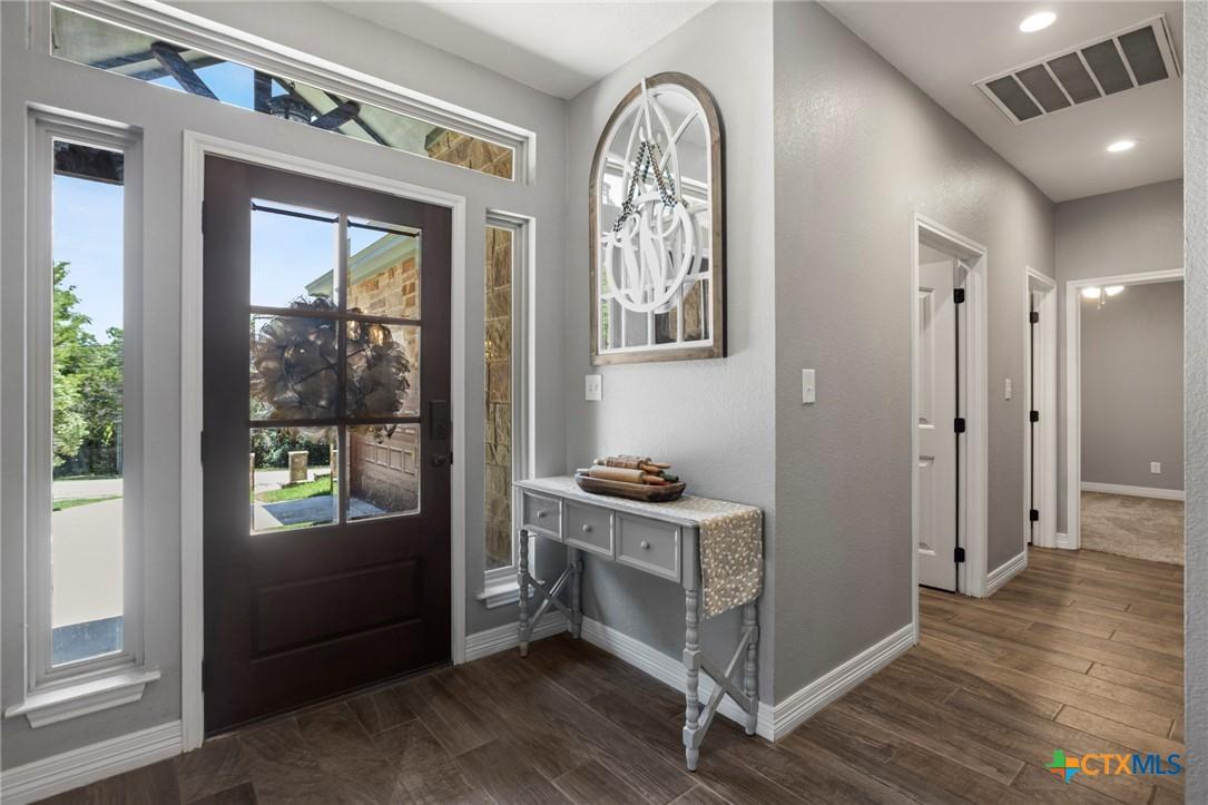 Image 4: Entryway and Laundry Room Door and then Door to Ac