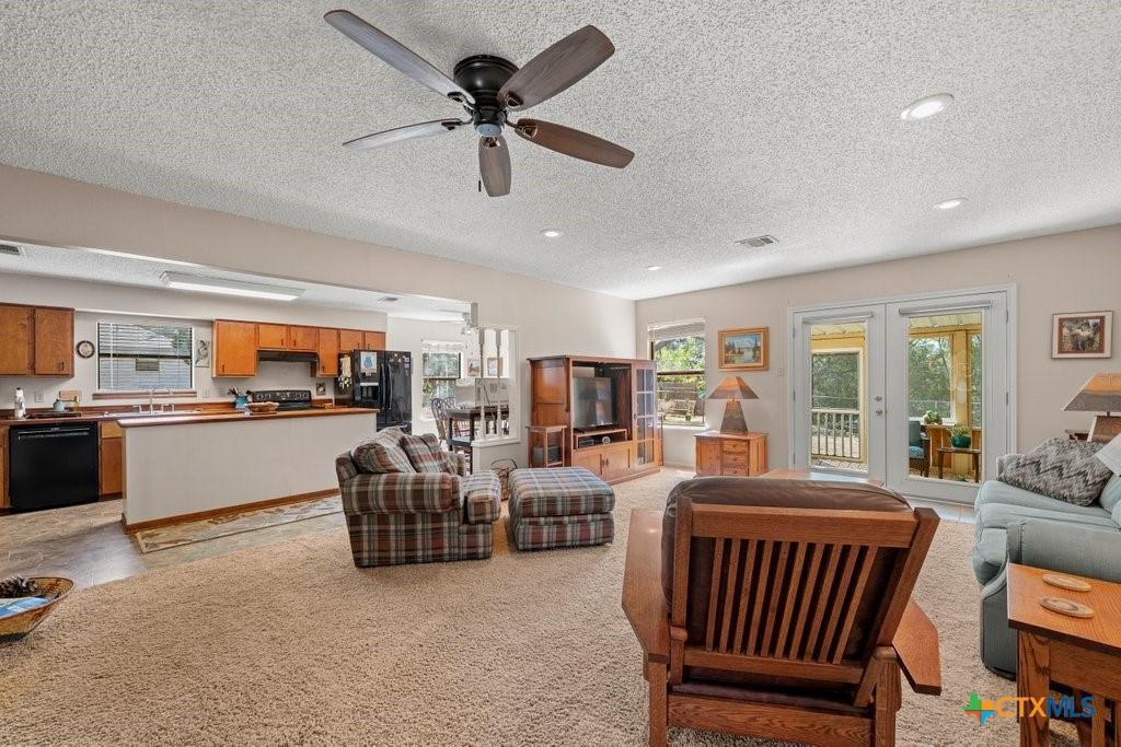 Image 3: Living area open to kitchen
