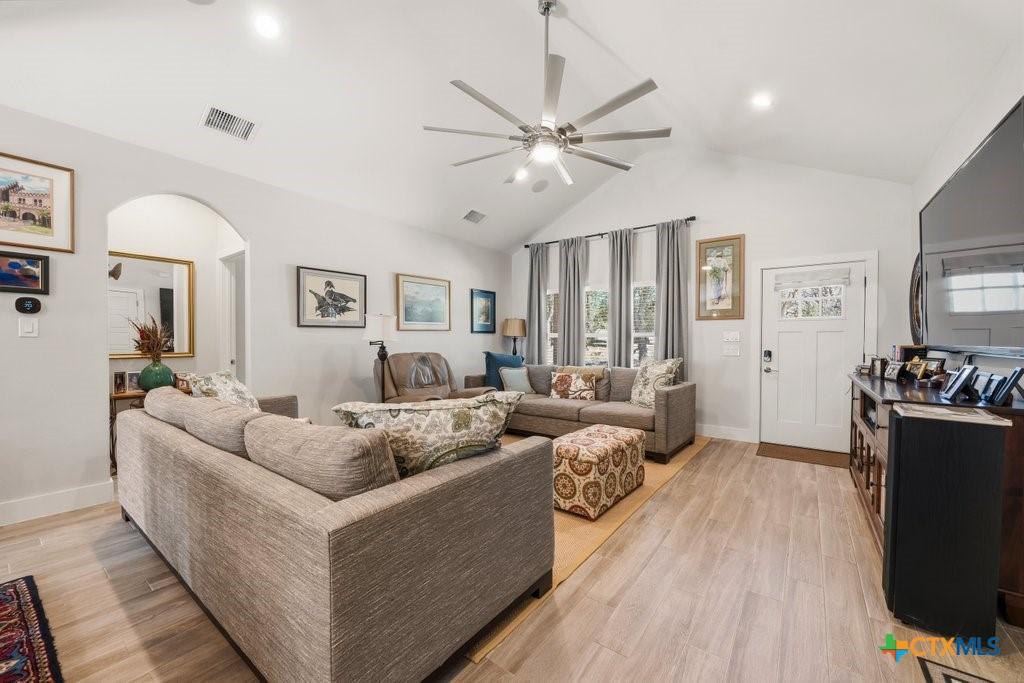 Image 4: viewing living area from dining to front door