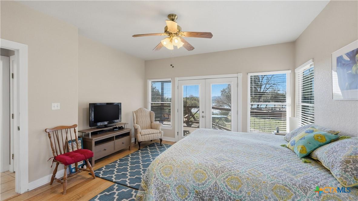 Image 3: Primary Bedroom with access to lower deck