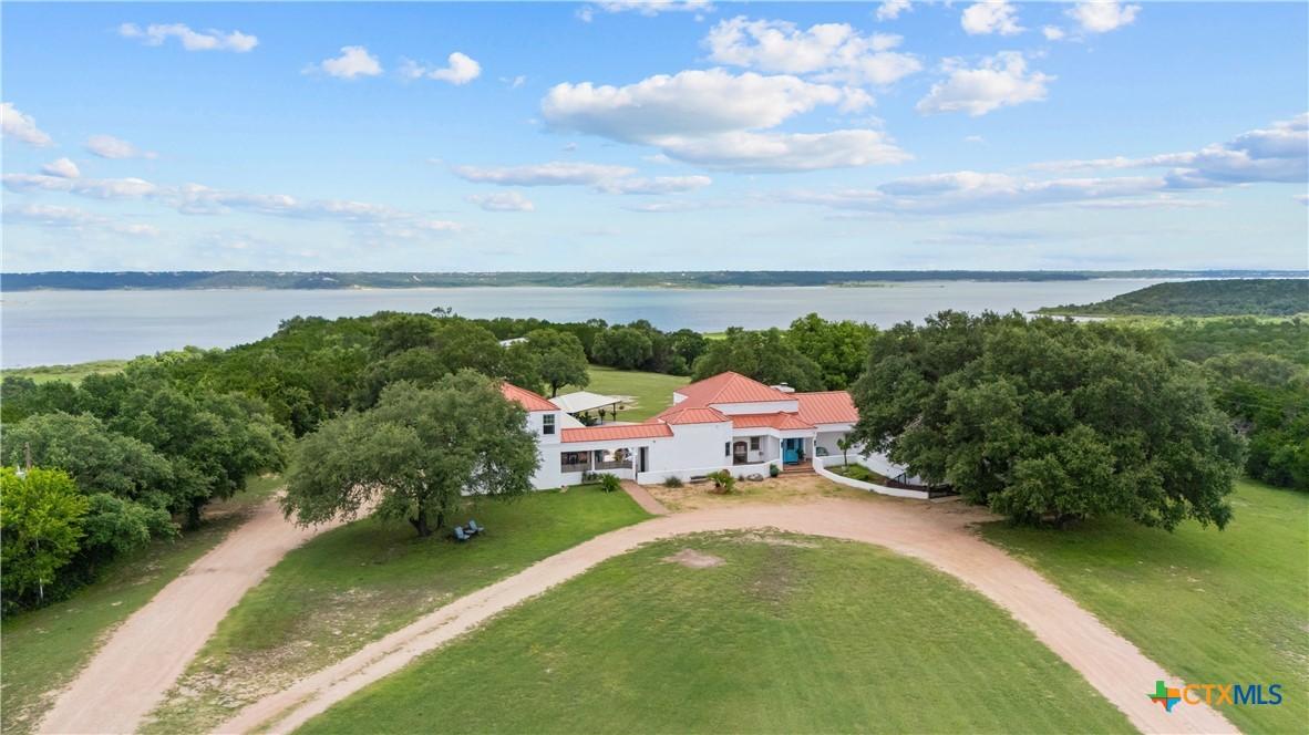 Image 1: Drone of front with private walking path, fully fe