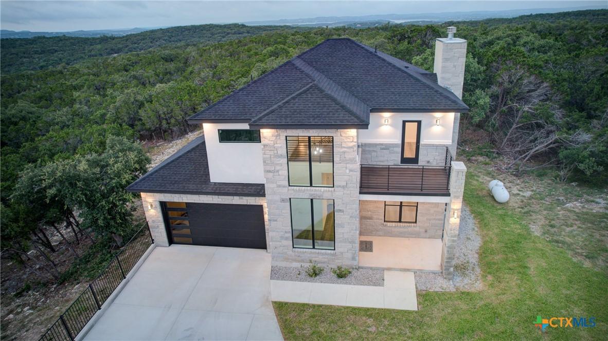 Image 3: Beautiful entry way windows flood the interior wit