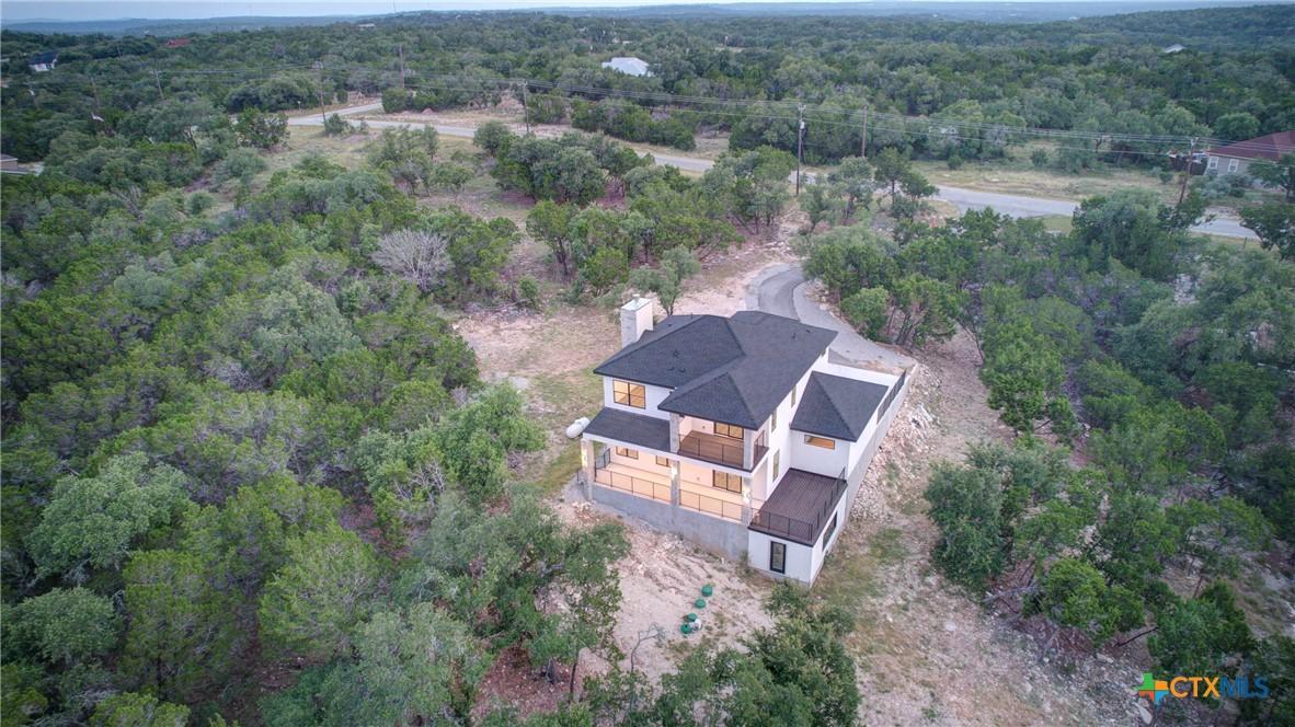 Image 4: Covered back patio with decking. Great place to en