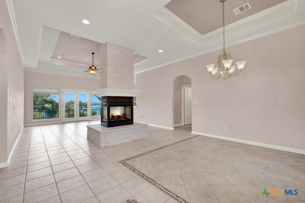 Image 3: Entry Way View and Formal Dining Room and Living R