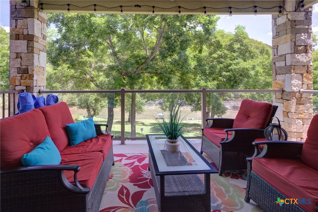 Image 4: Private Balcony with COVERED outdoor sitting area.