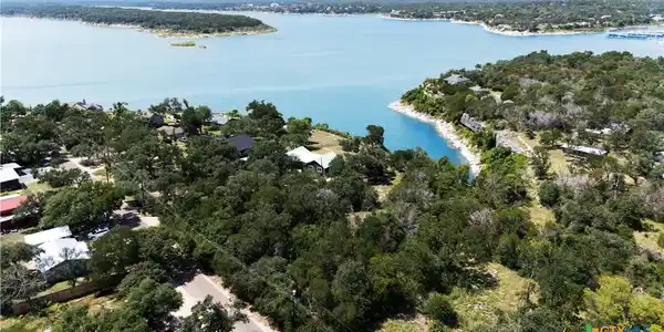 Image 2: Enjoy views of the lake one side and woods on the