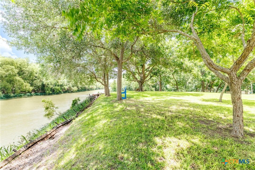 Image 2: Front of property showing river frontage