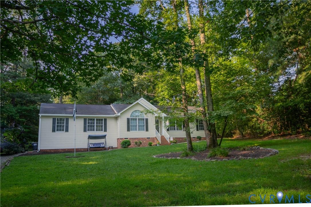 Image 1: Single story home with a front lawn, view of scatt